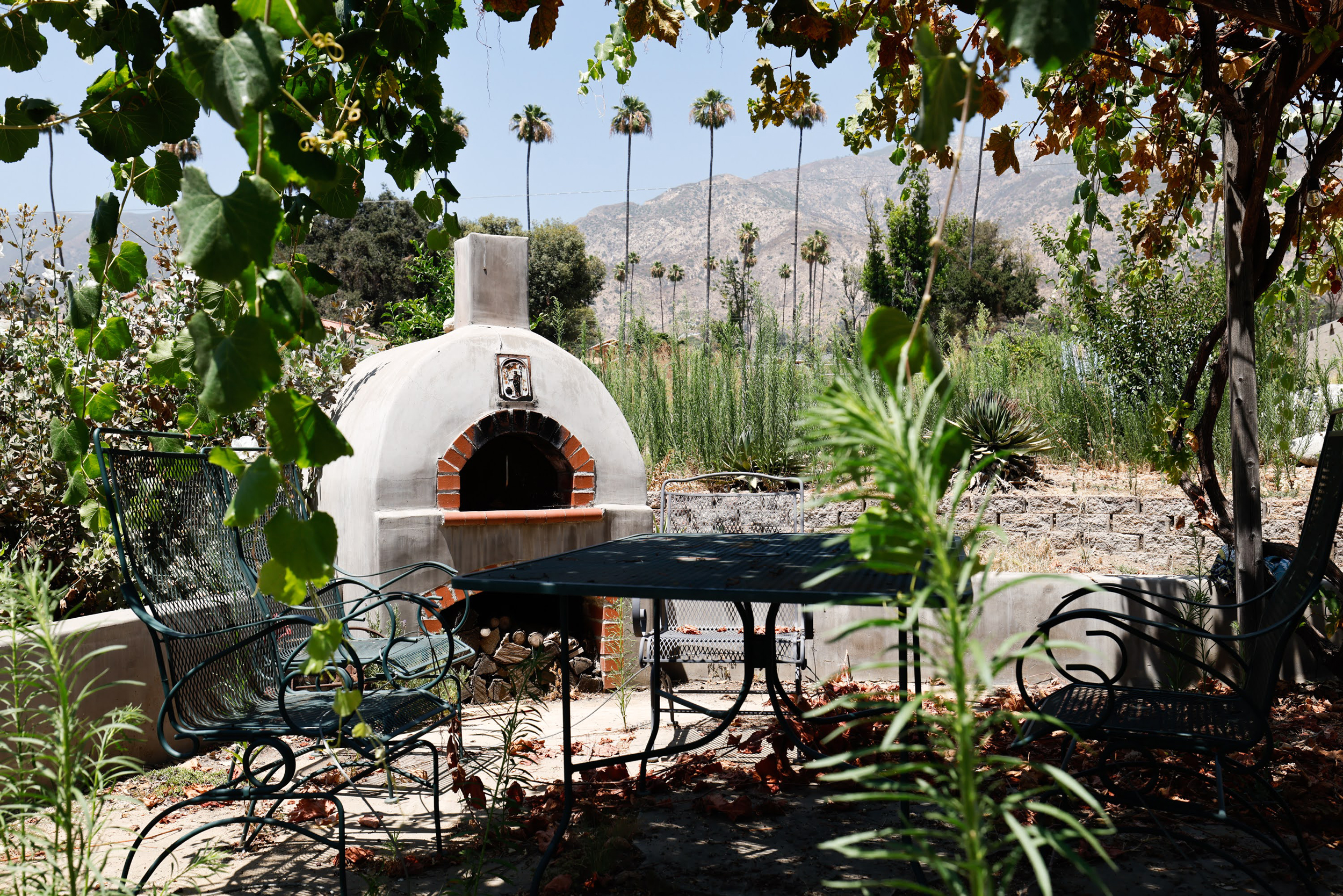 A pizza oven is one of the only things that survived the Eaton Fire on Sylvie Andrews’ property. Credit: Carlin Stiehl/Inside Climate News