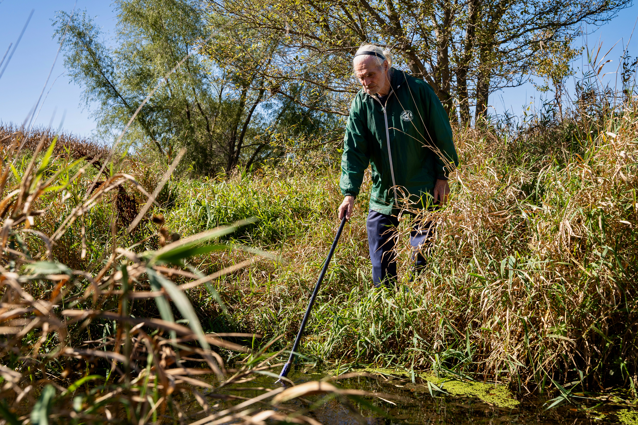Gordon Garrison monitors nitrate levels in a stream on his property as a Nitrate Watch volunteer. The stream feeds into the Des Moines River.