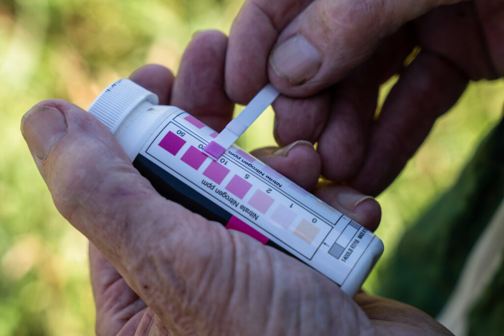 Gordon Garrison monitors nitrate levels in a stream on his property as a Nitrate Watch volunteer. The stream feeds into the Des Moines River.