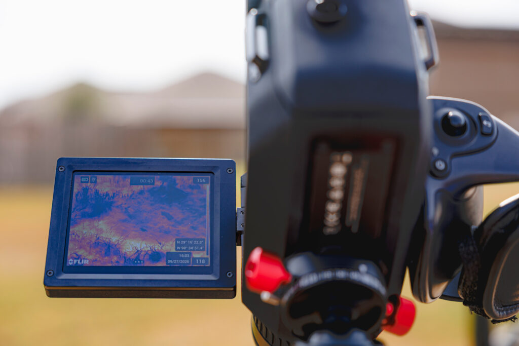 James Tim Doty uses a thermal imaging camera to record hydrocarbon emissions from the plugged Thompson Callaway Spears #1 well on Sept. 27. Credit: Sam Owens/San Antonio Express-News