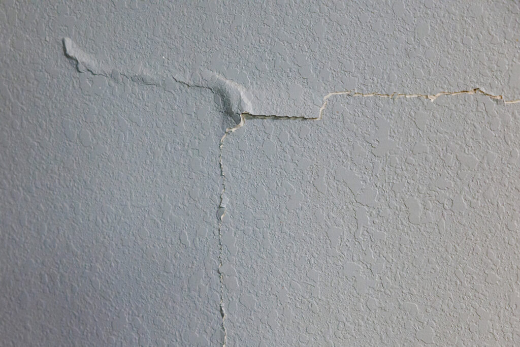 Paint separates from the wall along a deep crack spanning the dining room wall in the Pacheco family’s home in southwest San Antonio. Credit: Sam Owens/San Antonio Express-News