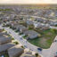 The Thompson Callaway Spears #1 well, located on the vacant lots enclosed by black metal fencing, stands next to homes inside the Preserve at Medina subdivision in southwest San Antonio. Credit: Sam Owens/San Antonio Express-News