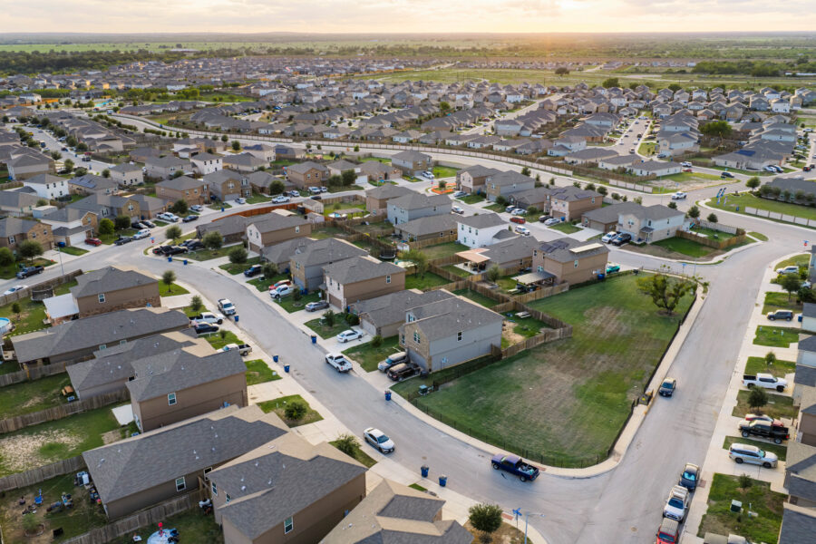 The Thompson Callaway Spears #1 well, located on the vacant lots enclosed by black metal fencing, stands next to homes inside the Preserve at Medina subdivision in southwest San Antonio. Credit: Sam Owens/San Antonio Express-News