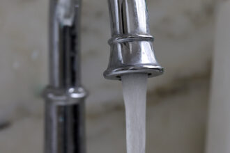 A new study that reanalyzed federal monitoring datafound that estimated PFAS concentrations in U.S. drinking water could be more than twice as high as calculations that treat results below laboratory reporting limits as zero suggest. Credit: Justin Sullivan/Getty Images.