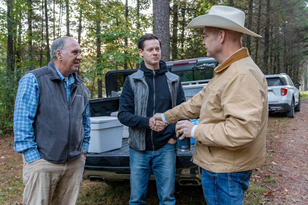 Fenn Church (left) speaks with Rep. Phillip Ensler (center) and lawyer Jay Welborn. Credit: Lee Hedgepeth/Inside Climate News