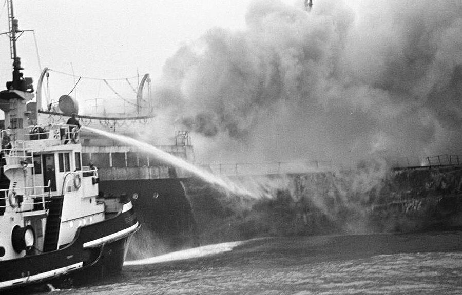 A fire rages on the SS South America, one of at least 90 fires that broke out on ships carrying fishmeal between the 1950s and 1970s. In an effort to prevent more fishmeal fires on cargo ships, the feed industry began treating fishmeal with ethoxyquin. Credit: Sepia Times, NY Daily News, Evers, Joost/Anefo