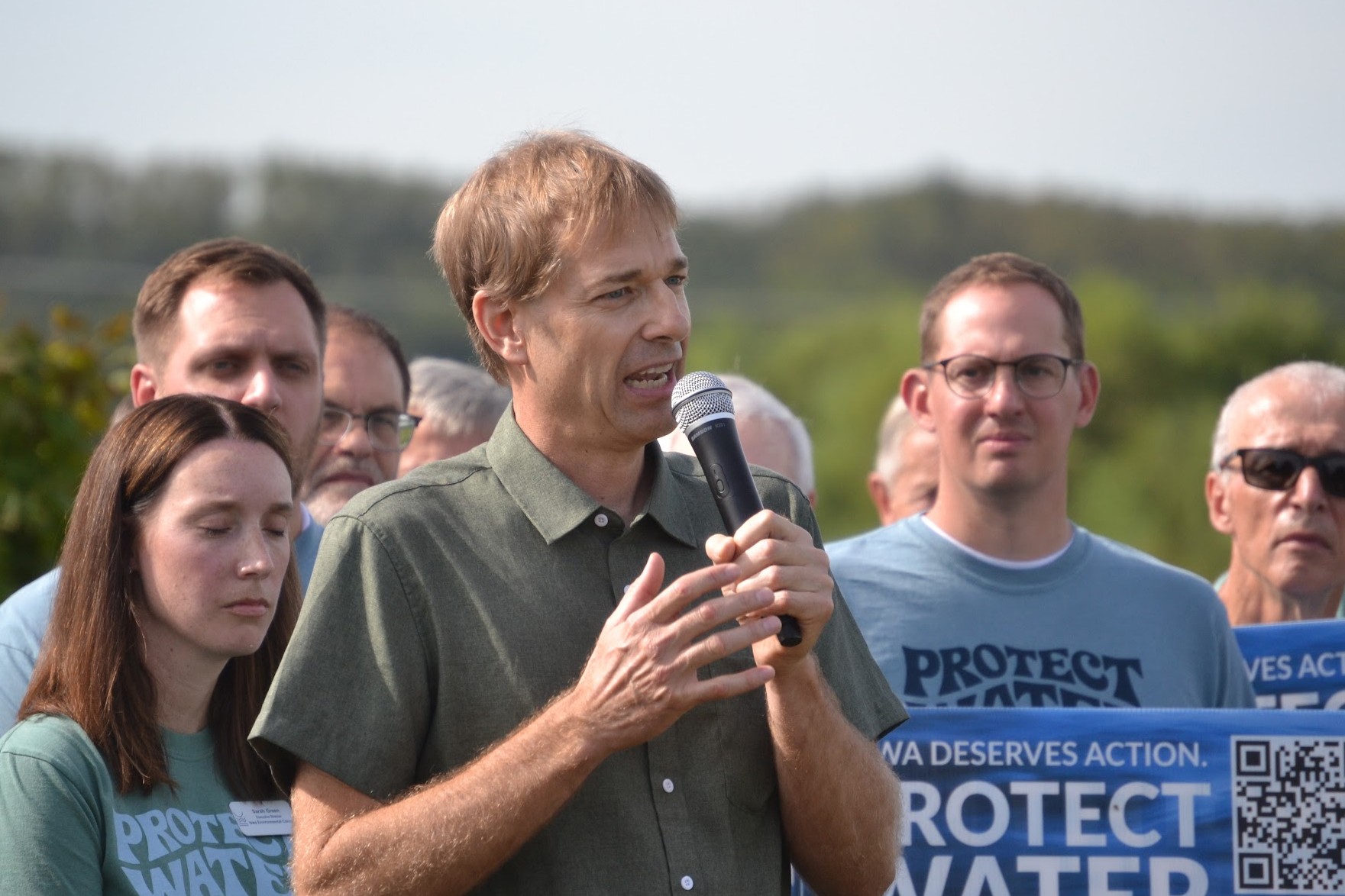John Bakehouse, a fifth-generation Iowa farmer diagnosed with stage-four non-Hodgkin lymphoma in late 2024, speaks at the Iowa Environmental Council’s “Protect Water, Prevent Cancer” launch in September. Credit: Anika Jane Beamer/Inside Climate News