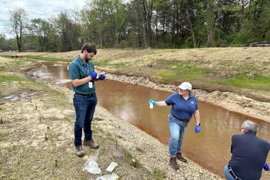 Workers with the Maryland Department of the Environment collect water samples from Piscataway Creek. Credit: Maryland Department of the Environment